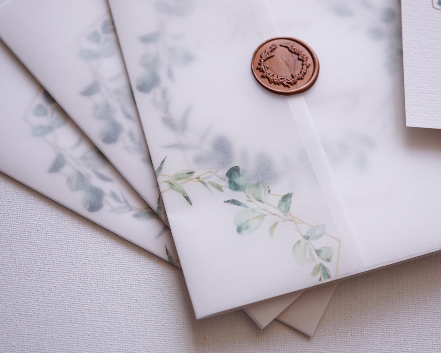 EM39 - Wedding invitation with paus cover and leaf wreath